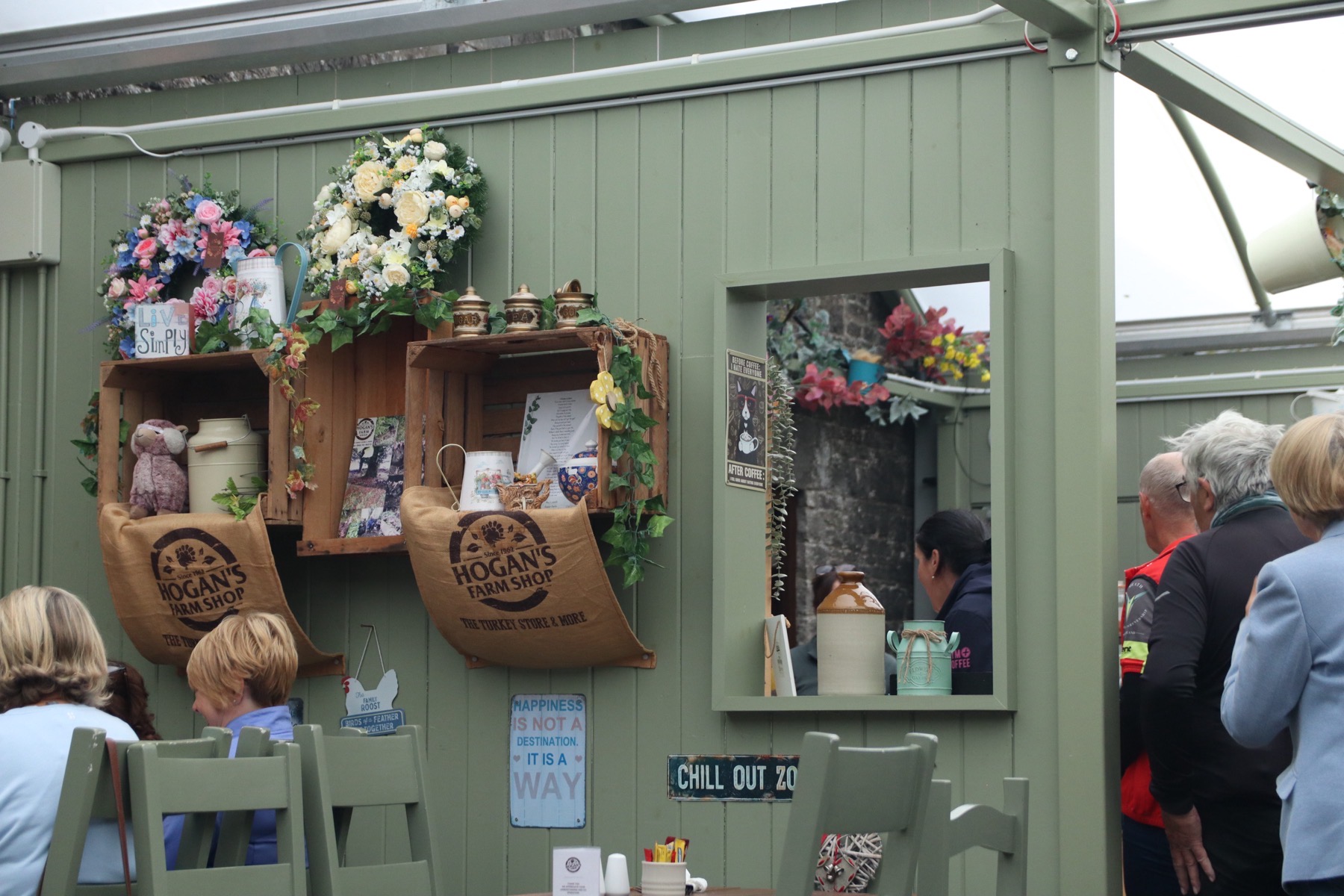 Seating and branded wall displays inside Hogan's Farm Shop