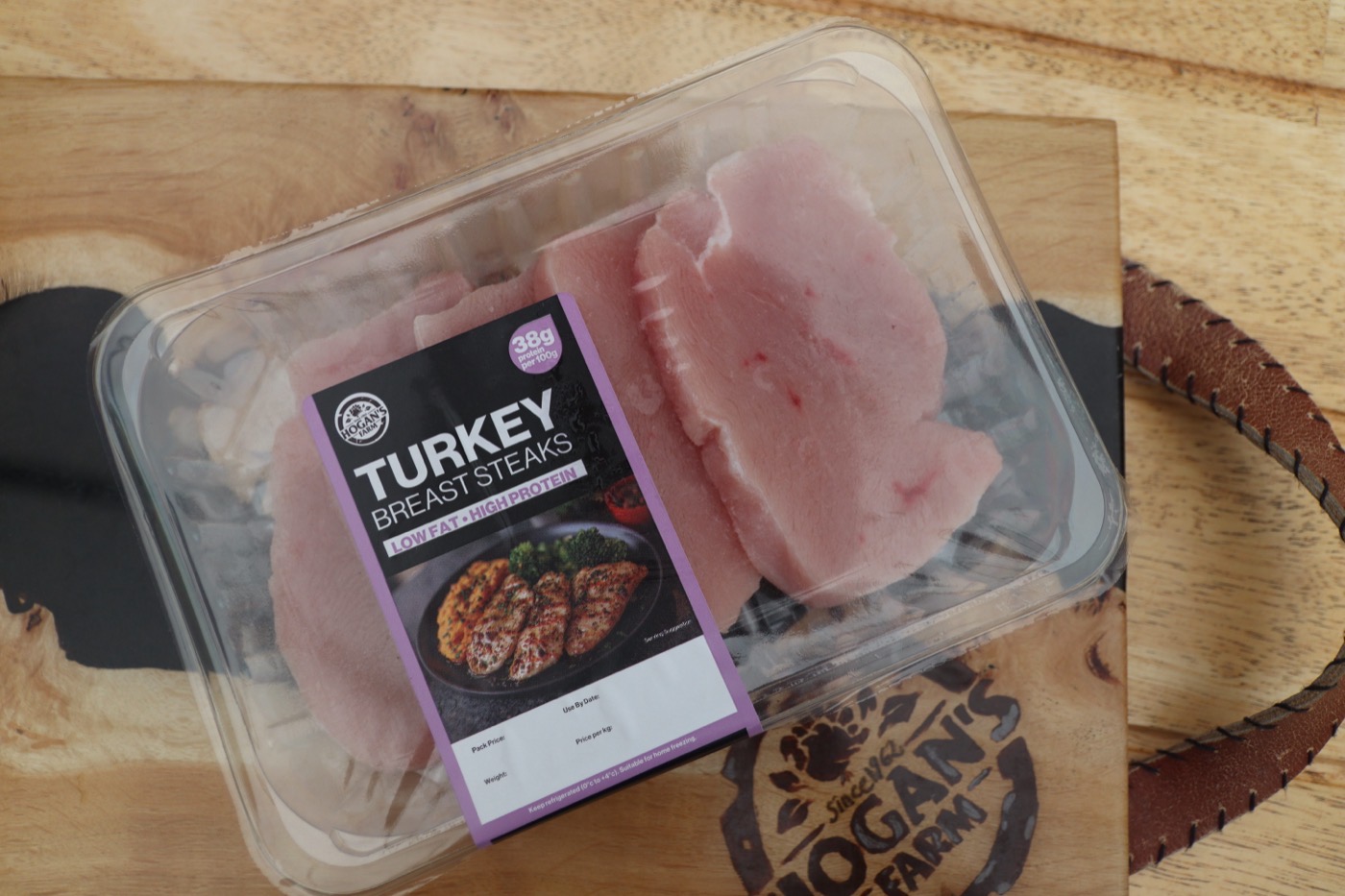Turkey breast steaks with farm logo visible